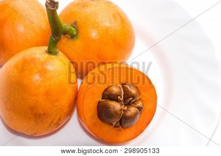 Close-up View Of Some Fresh And Juicy Loquats (eriobotrya Japonica) Isolated On  White Background. H