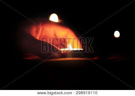 Candles Burning Over The Star Of David In Memory Of The Dead.