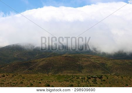 Low Laying Stratus Clouds And Fog Over A Hillside Taken In Rural Coastal California