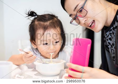 Aunty Showing Smart Phone For Little Baby Child For Talking With Her Father During Her Breakfast