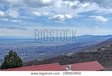 Top View Of Alazani Valley In Georgia In Springtime, In The Distance Through The Haze Visible To The
