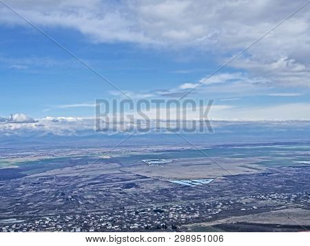 Top View Of Alazani Valley In Georgia In Springtime, In The Distance Through The Haze Visible To The