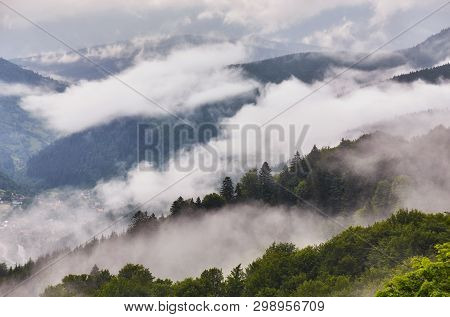 Summer Mountain Panorama. Small Wooden House Cottage And Barn On Green Mountain Valley On Bright Fog