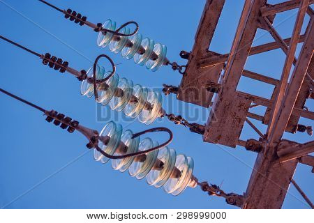 Part Of Electricity Transmission Power Line - High Voltage Tower - With Glass Insulators