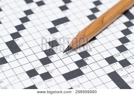 Close Up Of A Pencil On An Unanswered Crossword Puzzle