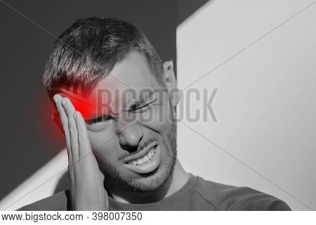Young Man Touching His Temple And Having Strong Tension Headache. Cluster Headache. Man Suffering Fr