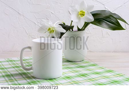 White Coffee Mug Mockup With Lily In Vase On Green Checkered Napkin.  Empty Mug Mock Up For Design P