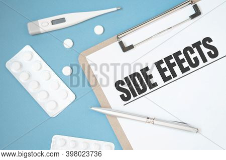 Notebook Page With Text Side Effects On A Table With A Pills And Pencil, Medical Concept, Top View