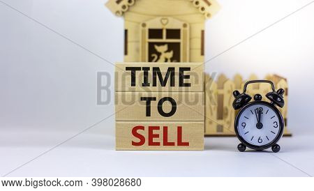 Time To Sell Real Estate. Wooden Blocks Form The Words 'time To Sell' Near Miniature House. Black Al