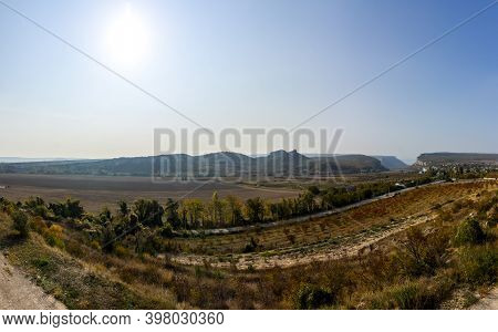 Mountains And Forests Of Crimea. Coniferous And Deciduous Trees On The Hills Of The Mountains And Ro