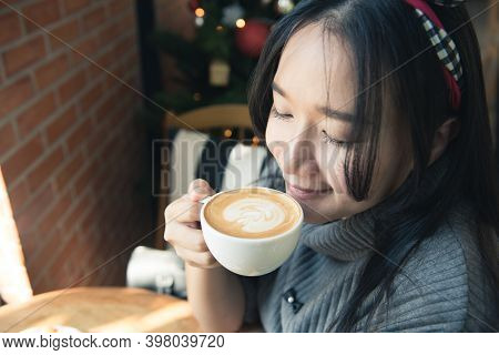 Woman Drinking Coffee Latte Art In Relax Time