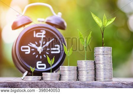 Close Up Of Stacking Gold Coins With Green Bokeh Background ,business Finance And Money Concept,save