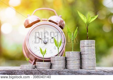 Close Up Of Stacking Gold Coins With Green Bokeh Background ,business Finance And Money Concept,save