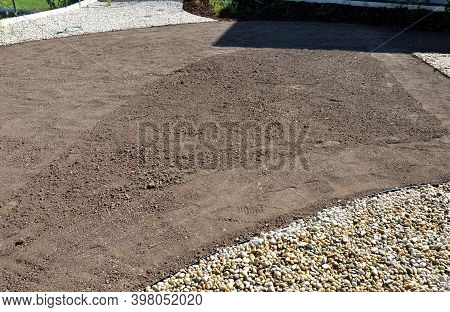 Soil Preparation Before Sowing The Lawn With A Soil Cultivator. Soil Loosening, Raking, Sowing. The 