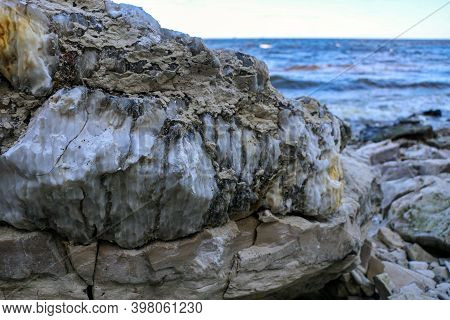 Diverse Colored Quartz Rock In Cut Of The Earth. Deposits Of Gray, White, Orange Quartz. Untreated S