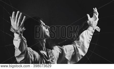 Young Man In Medieval Clothes In The Image Of Da Vinci, Dreams Of Flight, A Sketch Of A Mechanical W