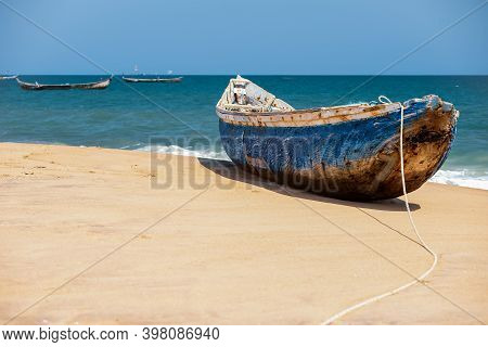 A Blue Painted African Fishing Boat On A Beach In Keta Ghana West Africa