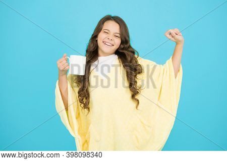 Wellbeing Concept. Little Girl With Long Hair. Feeling Comfy. Adorable Child On Turquoise Background