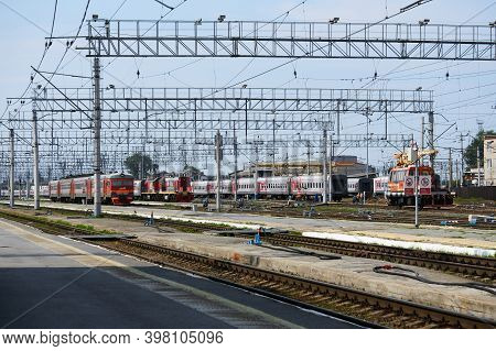 Perm, Russia - August 07, 2020: Intercity And Regional Passenger Trains On The Tracks Near The Platf