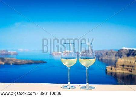 Two Glasses Of White Wine With Aegaen Sea In Background, Toned