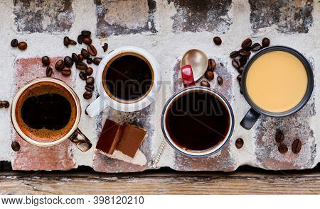 Several Cups Of Espresso, Ristretto And Mocha On A Brick Windowsill. Top View Of Hot Coffee, Chocola