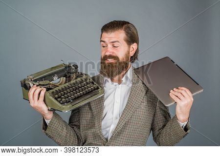 Typewriter Vs Laptop. Journalist Holds Typewriter And Laptop. Antiques, Old, Journalist, Secretary, 
