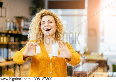 Smiling Blond Curly Woman Holds Eco Natural Alunite Deodorant And In Other Hand Plastic Package Of D