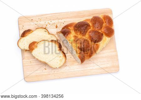 Top View Of A Traditional Sweet Braided Yeast Bread Called - Zopf, Challah, Petticoat Or Brioche On 