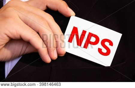 Closeup On Businessman Holding A Card With Text Nps Net Promoter Score, Business Concept Image With 