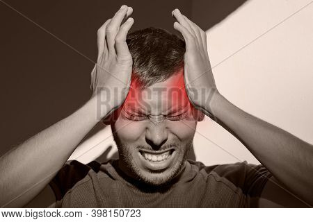 Man Suffering From Painful Migraine Or Strong Tension Headache. Cluster Headache, Stress. Hands On H
