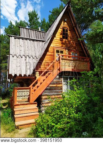 An Old Russian Wooden House Of Round Logs, Called Terem