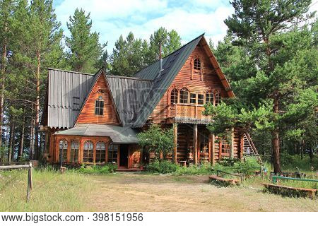An Old Russian Wooden House Of Round Logs, Called Terem