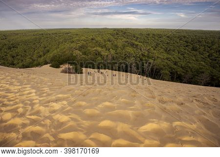 La Teste-de-buch, France - August 12, 2017: Tourists Climbing The Dune Of Pilat, The Tallest Sand Du