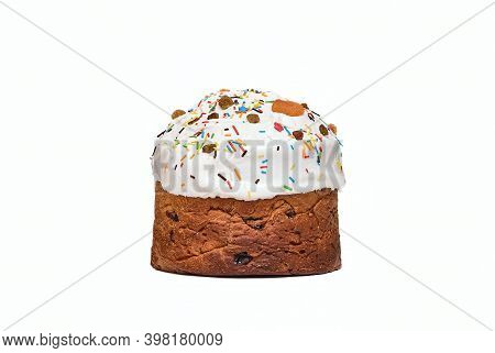 Christmas Cake, Sprinkled With Icing And Decorated With Dried Apricots, Raisins And Colored Topping.