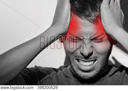 Close Up Portrait Of Young Man Suffering From Painful Migraine Or Strong Tension Headache. Cluster H