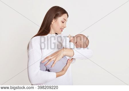 Mother Playing With Baby Girl, Happy Family Having Fun Indoor, Cheerful Sweet Kid In Mommy's Hands, 