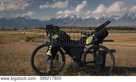 The Mixed Terrain Cycle Touring Bike With Bikepacking. The Trip On Multitrack Bike, Outdoor Road In 
