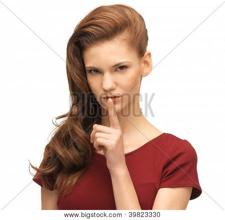 素敵な 10 代の少女の唇に指で赤いドレスを着ての写真
