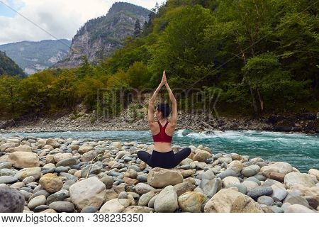 Yoga Classes In Nature. The Concept Of Playing Sports Alone. Social Exclusion. A Woman Does Yoga On 