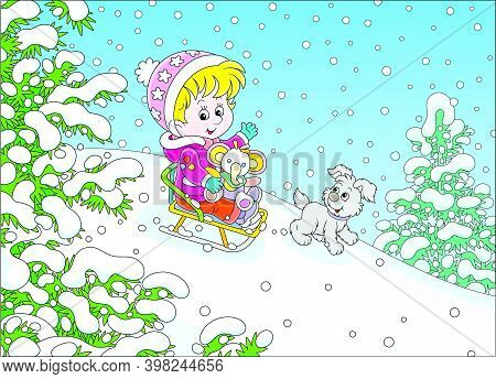 Happy Little Girl And Her Merry Small Puppy Cheerfully Sledding Down A Snow Hill On A Playground In 