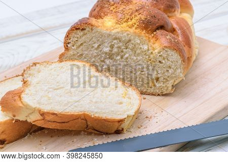 Close-up Of A Traditional Sweet Braided Yeast Bread Called - Zopf, Challah, Petticoat Or Brioche On 