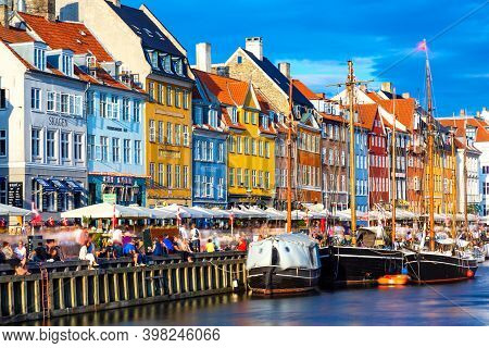 Copenhagen, Denmark - July, 2019: Copenhagen Iconic View. Famous Old Nyhavn Port In The Center Of Co