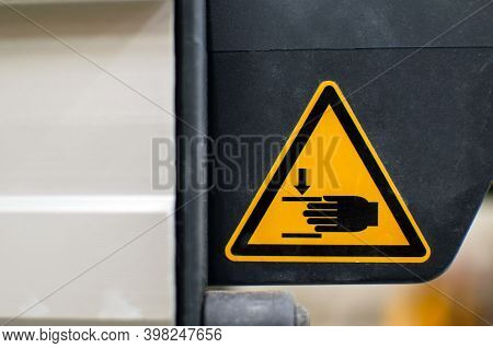 Warning Sign On Agricultural Machinery. Do Not Put Your Hands Out. Injury To Hands Is Possible.