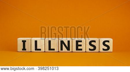 Illness Symbol. Wooden Cubes With Word 'illness'. Beautiful Orange Background. Medical And Illness C