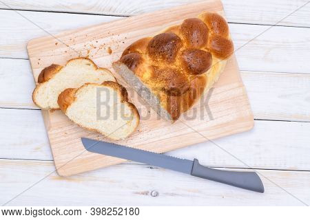 Top View Of A Traditional Sweet Braided Yeast Bread Called - Zopf, Challah, Petticoat Or Brioche On 