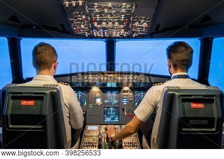 Gdansk, Poland - December 06, 2020: Simulator Of A Passenger Aircraft With A Cockpit And Pilots