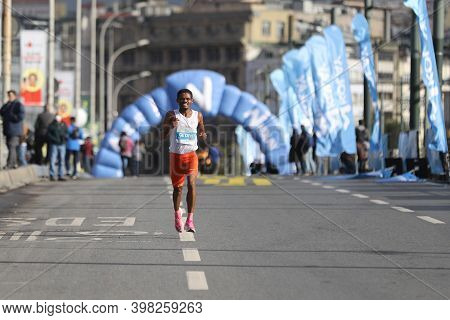 Istanbul, Turkey - November 08, 2020: Undefined Athlete Running In 42. Istanbul Marathon Which Inclu
