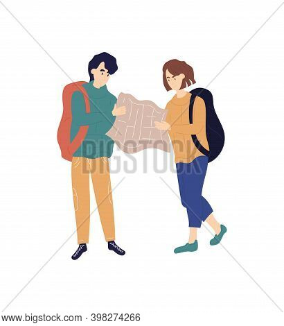 Young Caucasian Man And Woman With Backpacks Are Examining Map Together. Concept Of Happy Couple Tra