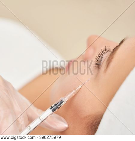 Near Eye Injection At Spa Salon. Doctor Hands. Closeup. High Quality. Pretty Female Patient. Beauty 