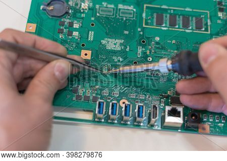Monoblock Computer Motherboard Repair. Replacing The Damaged Smd Capacitor